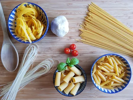 Italian pasta shapes: spaghetti, tagliatelle and penne